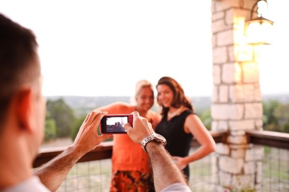 guest taking a picture with an iphone