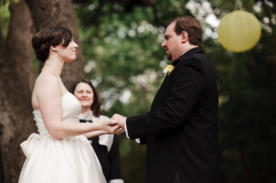 holding hands during the outdoor ceremony