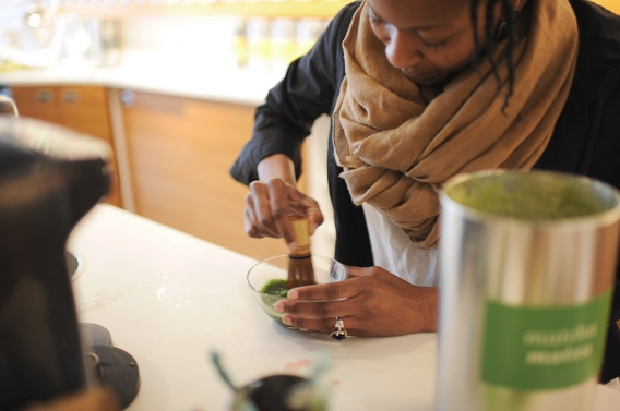 making green tea with a little broom