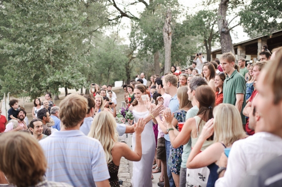 bride high-fiving guests