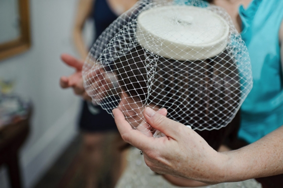 putting on bird cage veil