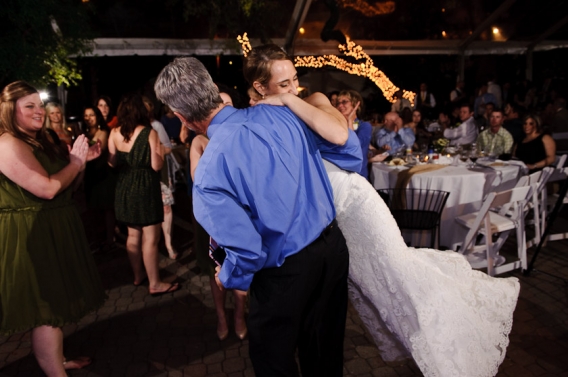 bride being swung around during the wedding