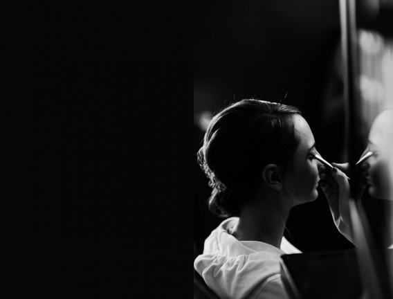 bride putting on makeup