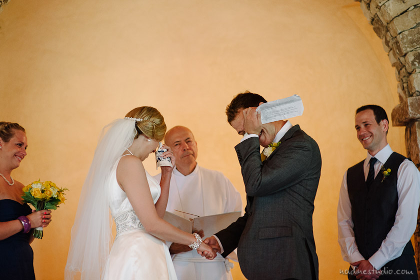 bride and groom crying during the ceremony