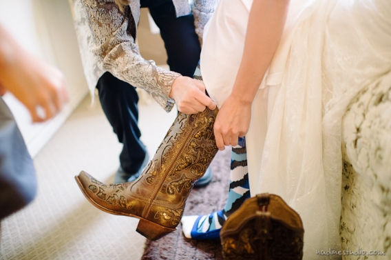 bride putting on texas boots