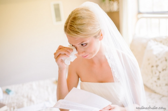 bride crying while reading eltter from the groom