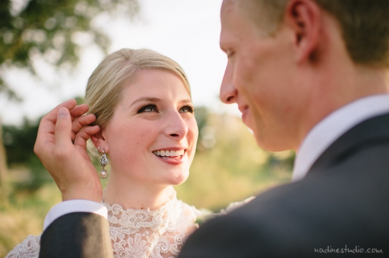 groom touching bride tenderly