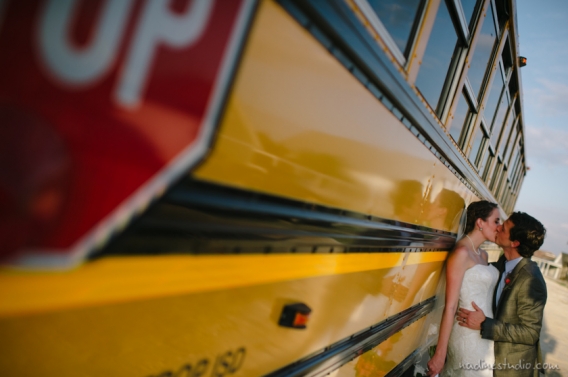 school bus photo with bride and groom, who are teachers