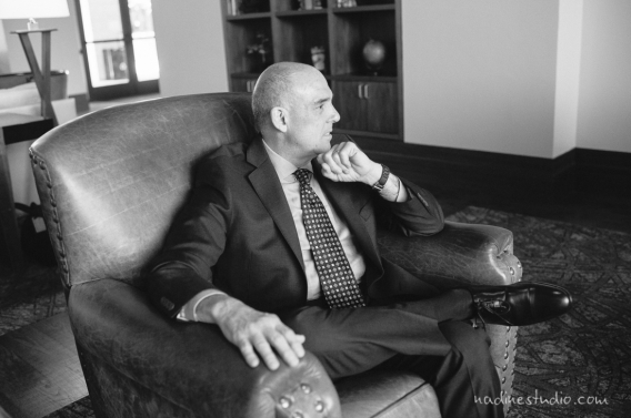 man sitting armchair