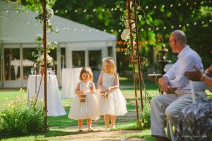 lovely tiny bridesmaids showering petals