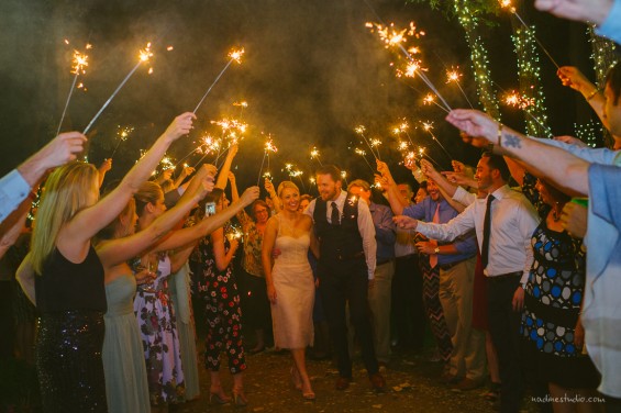 a classic sparkler exit framing the couple as they leave their wedding