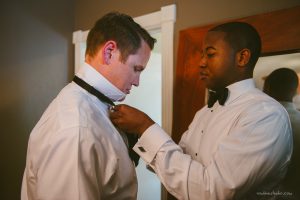 helping the groom get ready