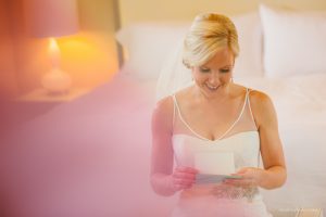bride opening a card from the groom