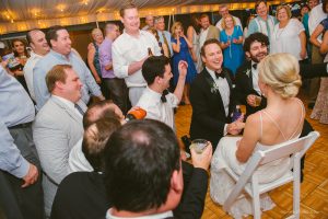 groomsmen singing to the bride