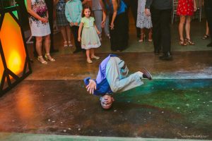 dancing on one's head during a reception in a wedding at manchaca