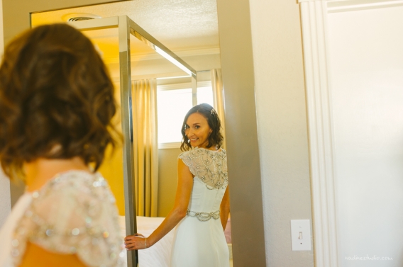 bride looking in the mirror