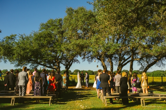 ceremony under a giant oak tree at stonehouse villa