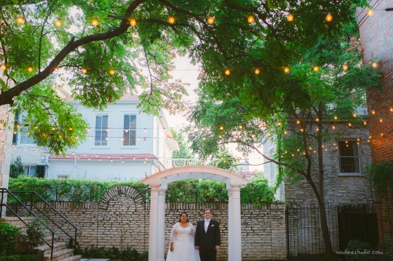 bride and groom and twinkle lights