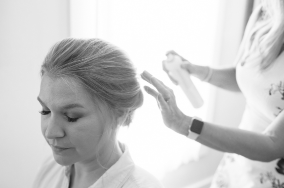 hairspraying the bride