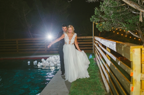 bride and balloons at night