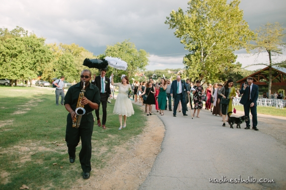 saxophone player leading out the ceremony